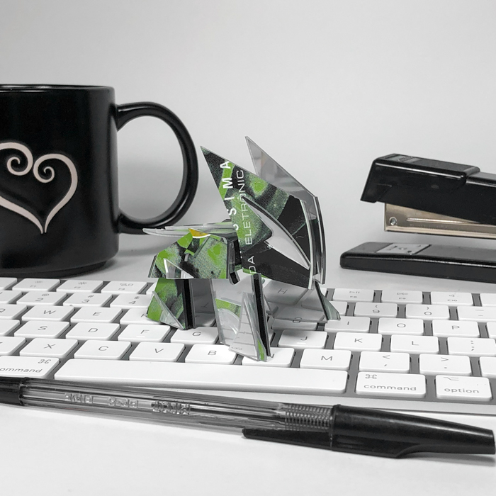 Two Tektile sculptures displayed on a desk with keyboard